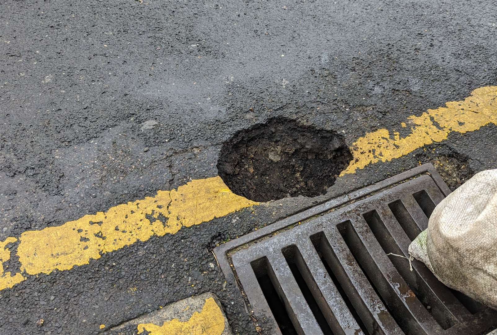 A large pothole on a street just a short walk from the heart of Folkestone...