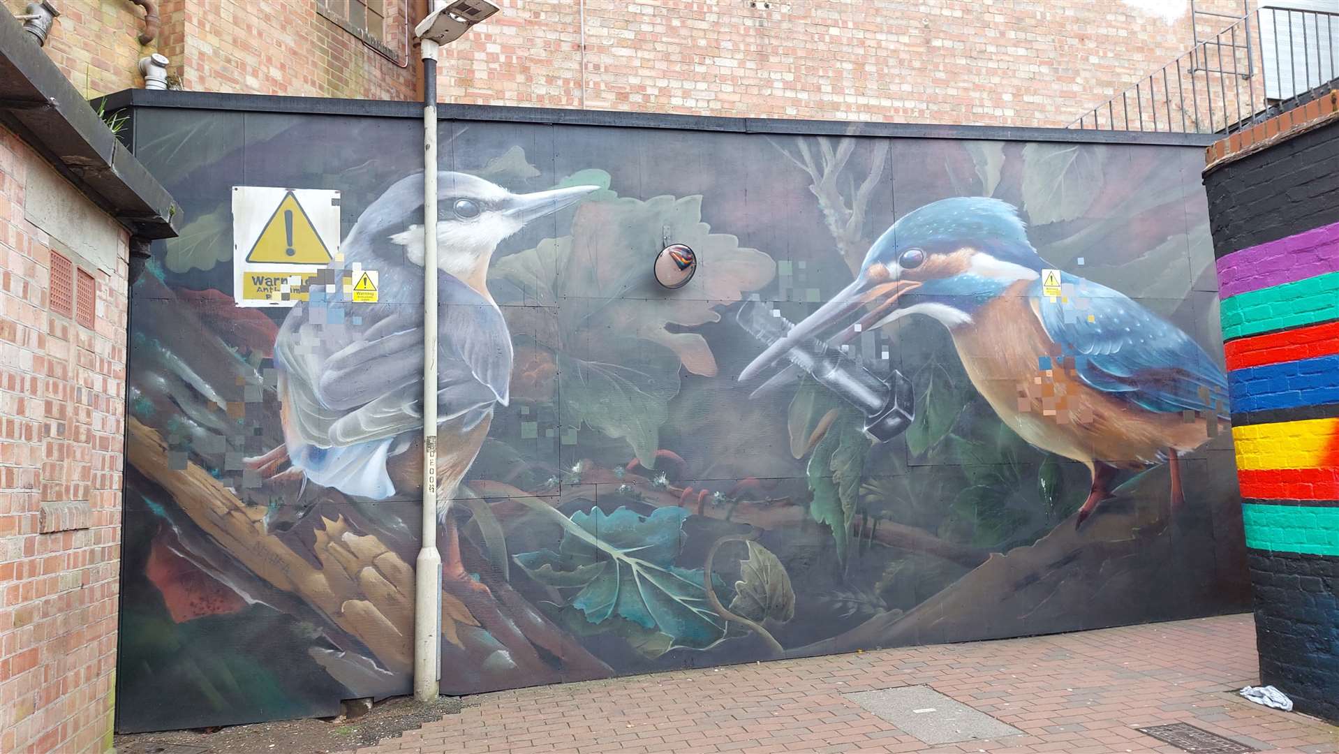 Aspire's 'Workers of the World" mural in St Johns Lane passageway