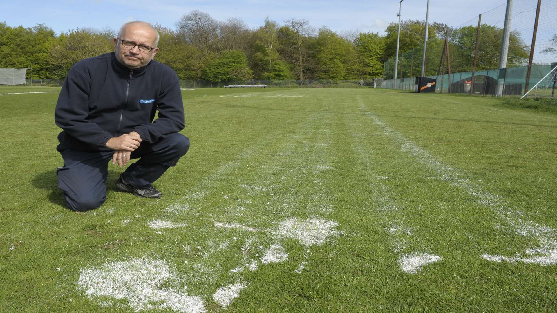 Richard Cross with paint the vandals threw on the pitch.