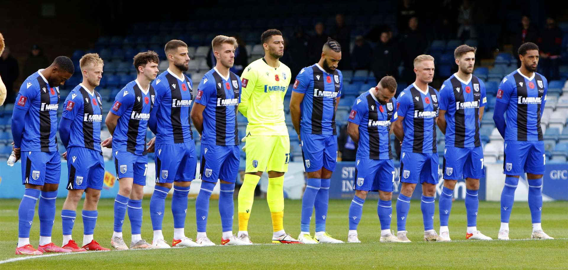 The players pay their respects to the fallen as Remembrance Day commemorations were held before kick-off. Picture: Andy Jones