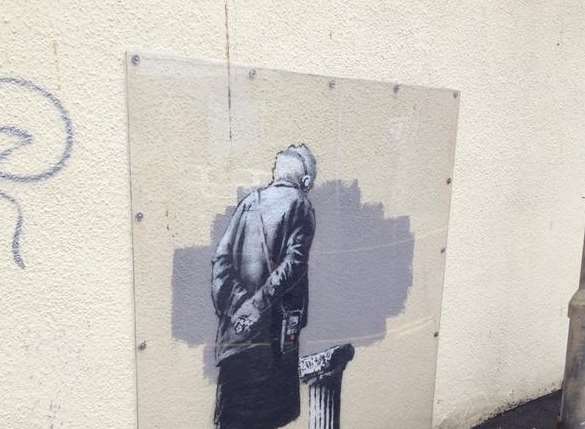 The Banksy artwork before vandals struck