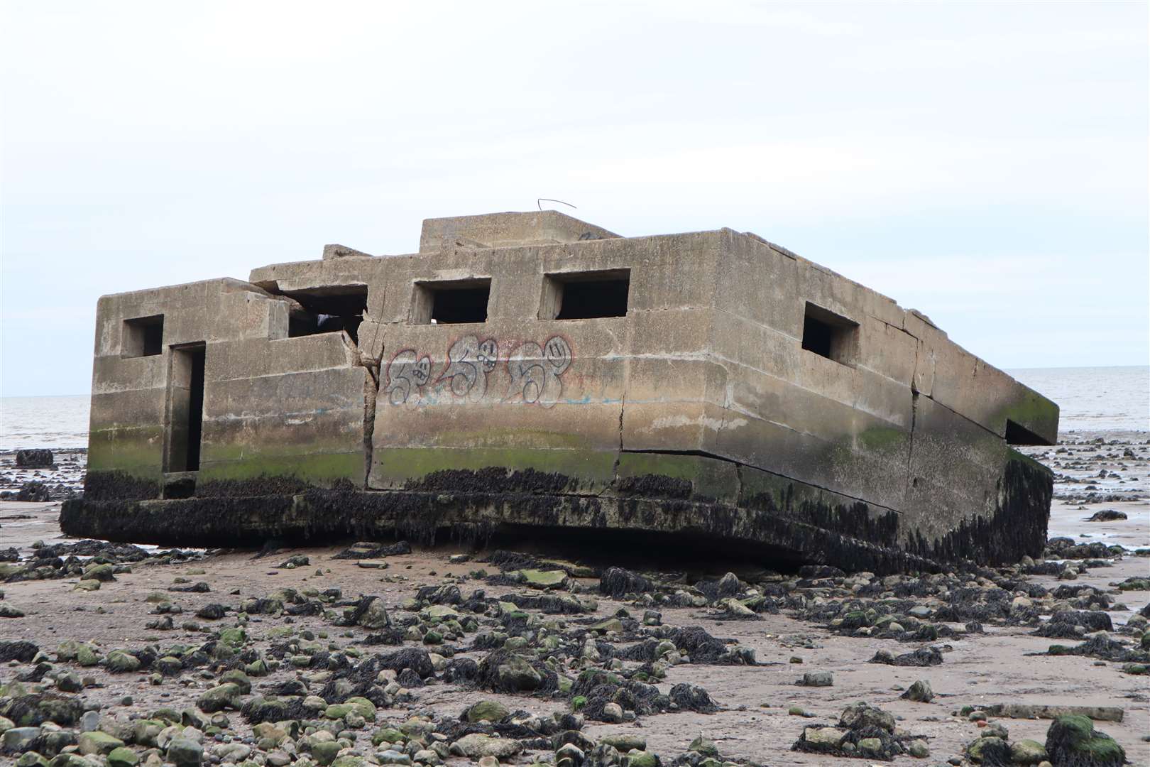 Second World War concrete defences have slipped from the top of the cliffs at Warden and are now on the beach