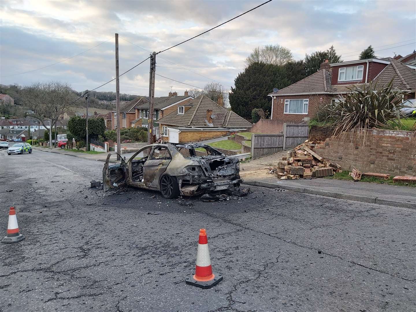 The fire-wrecked remains of the car in Walderslade. Picture: @KentPoliceMed