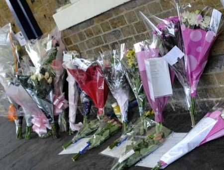 Floral tributes to Charlotte Sykes outside Gravesend station