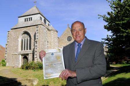 Peter MacDonald, who has just been made an honorary Alderman by Minster Parish Council, outside Minster Abbey Church, Minster.