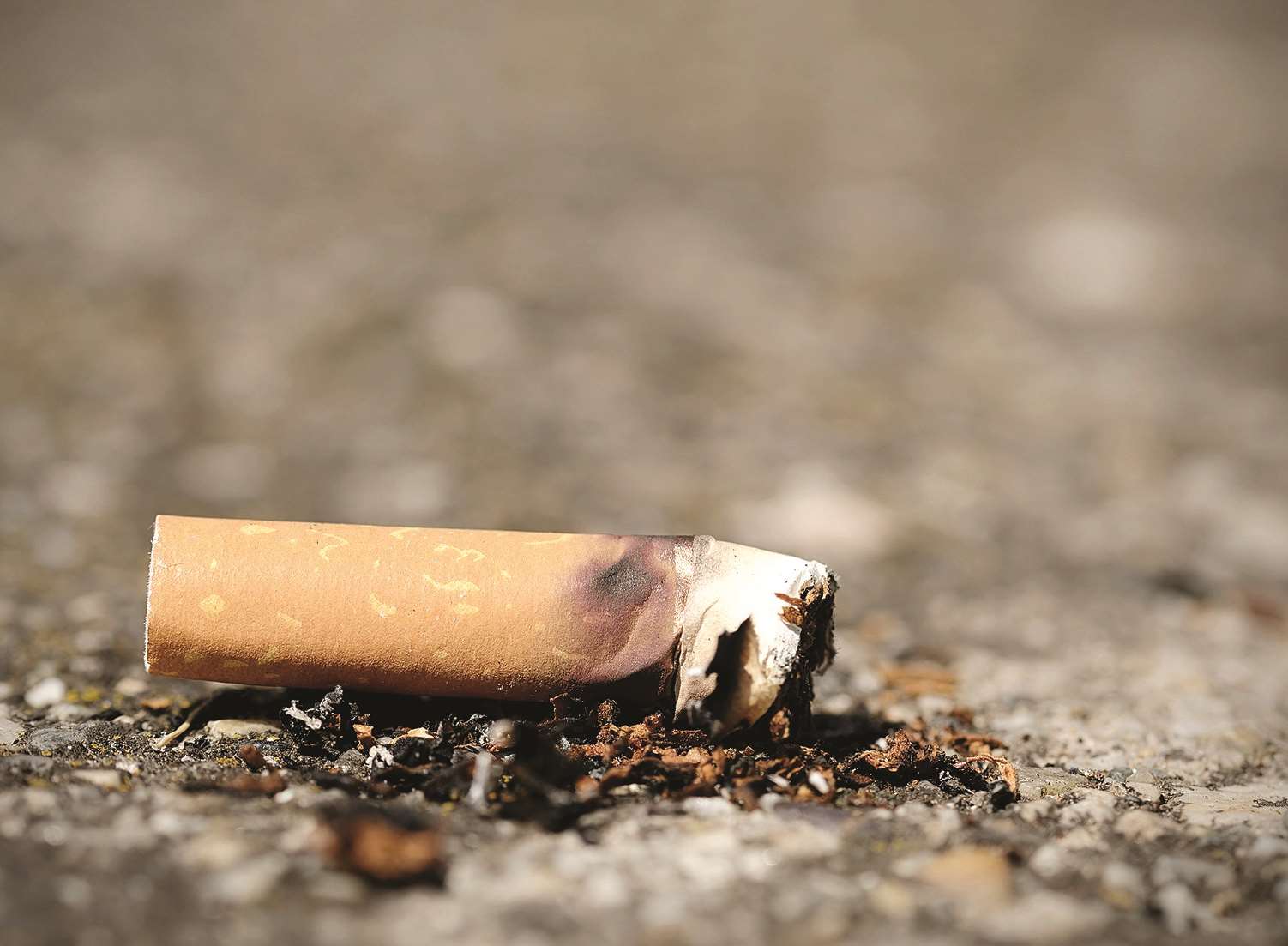 Kick the cigarette. Stock picture