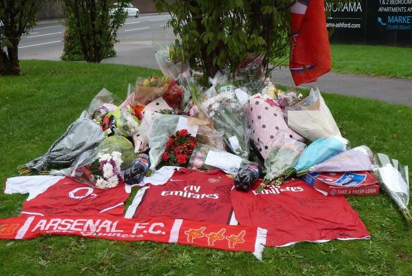 Floral tributes and scarves at the spot where Arsenal fan Danyl Ponsford died in Ashford