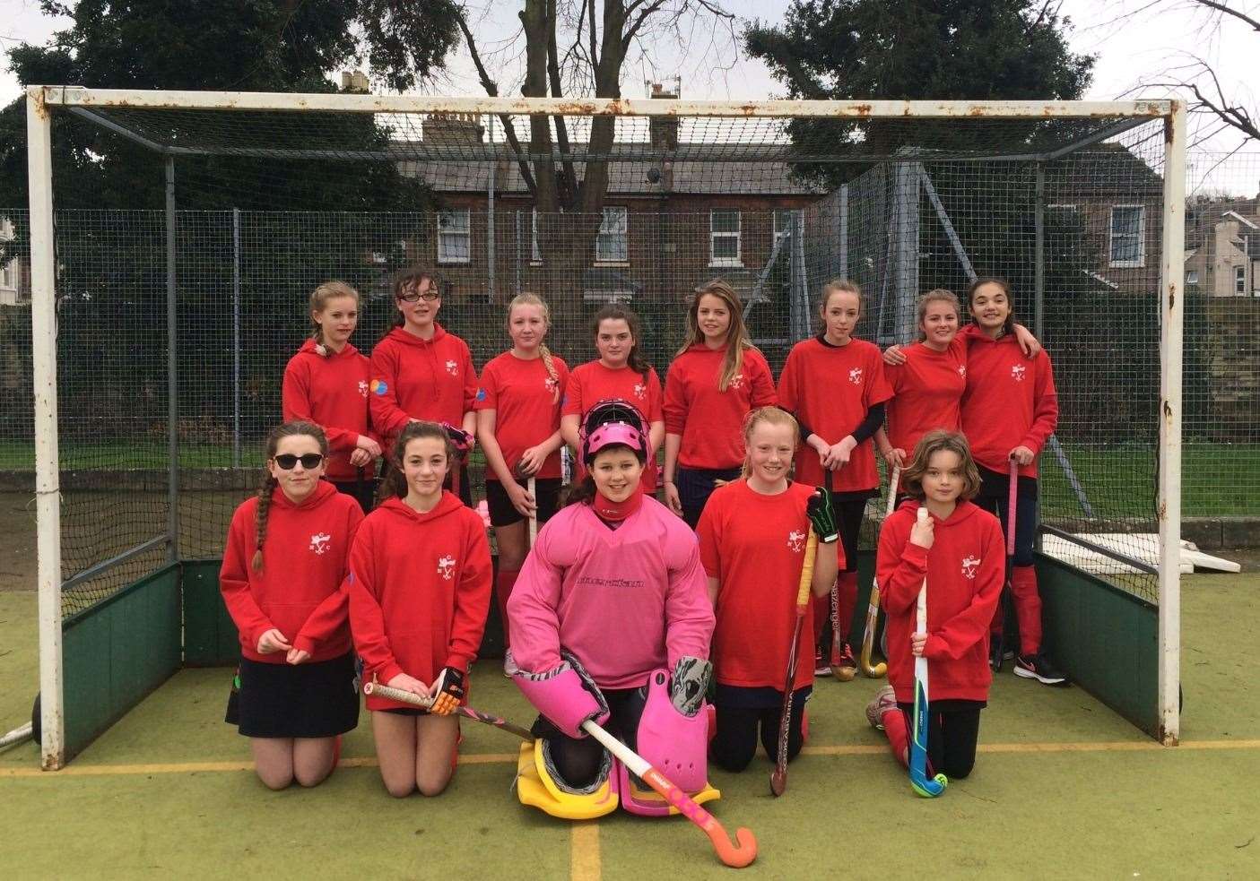 Talented hockey keeper Gabriella McCalister with her teammates