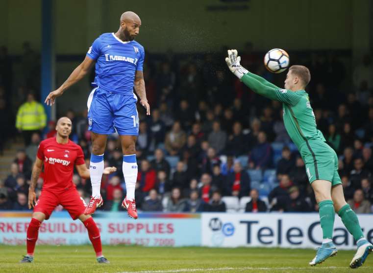 Gillingham's Josh Parker heads his team in front on Saturday. Picture: Andy Jones