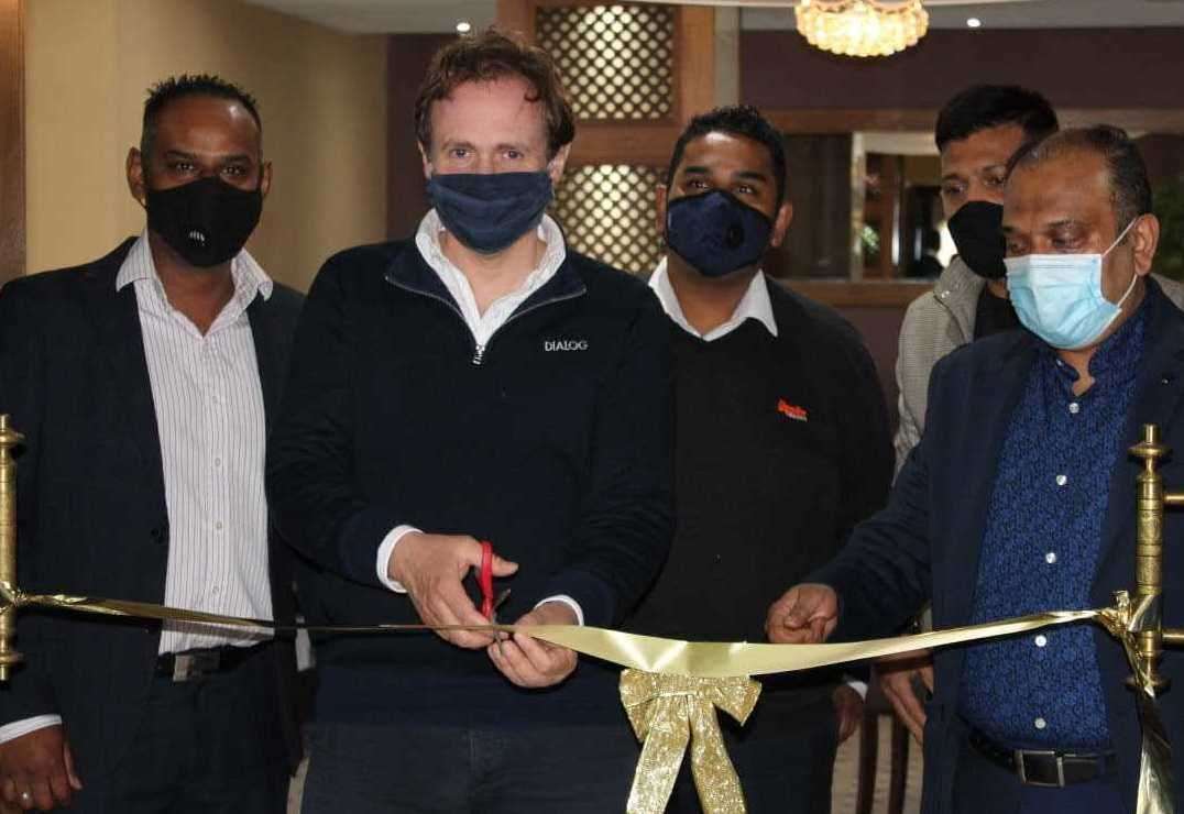 From left to right, Turmeric Square manager and director Kamrul Islam, MP Tom Tugendhat, director Johurul Islam, front-of-house supervisor Noyon Rahman, and owner and manager Sanu Miah. Picture: Johurul Islam