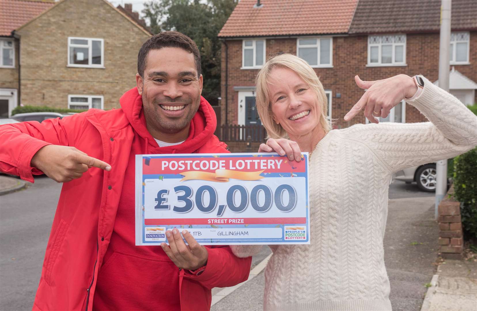 Danyl Johnson with Justine White who plans to buy a new kettle with her winnings
