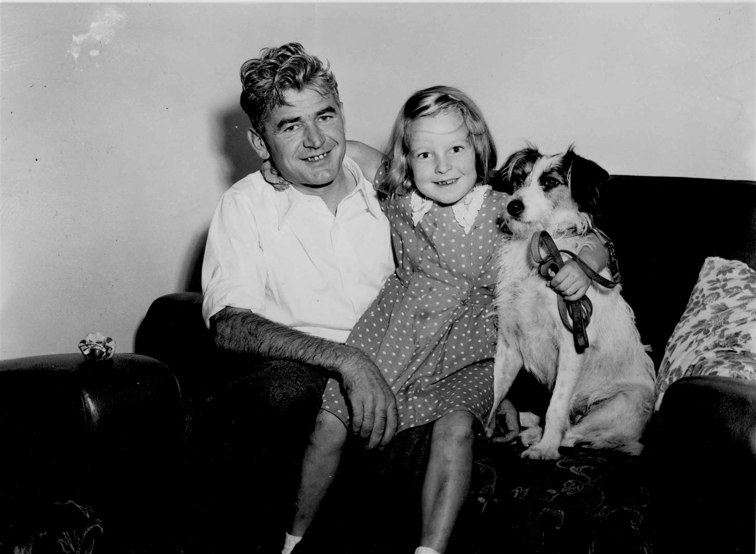 After more than two years in a North Korean prison camp, Signalman Arthur Miles, 35, was back in Barham with his daughter Gladys, six, and her dog, Suzy, in September 1952. He had been taken prisoner at the Battle of Imjin River in 1951 while serving with the Royal Corps of Signals during the Korean War, which began in June 1950 and ended in July 1953