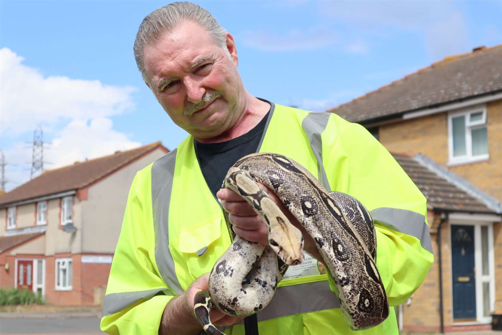 Ray Allibone of Swampys Wildlife Rescue in Sheerness with the Boa constrictor which bit him. Picture: John Nurden