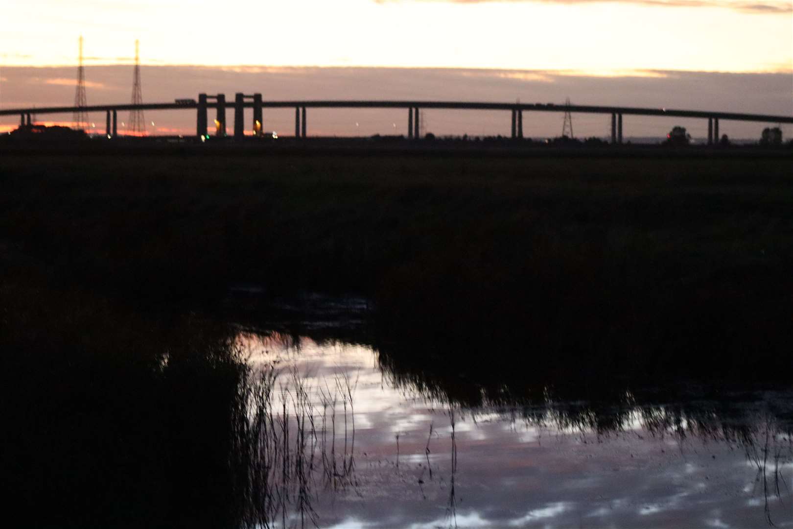 Sunset over Elmley Nature Reserve with the Sheppey Crossing in the background. Picture: John Nurden