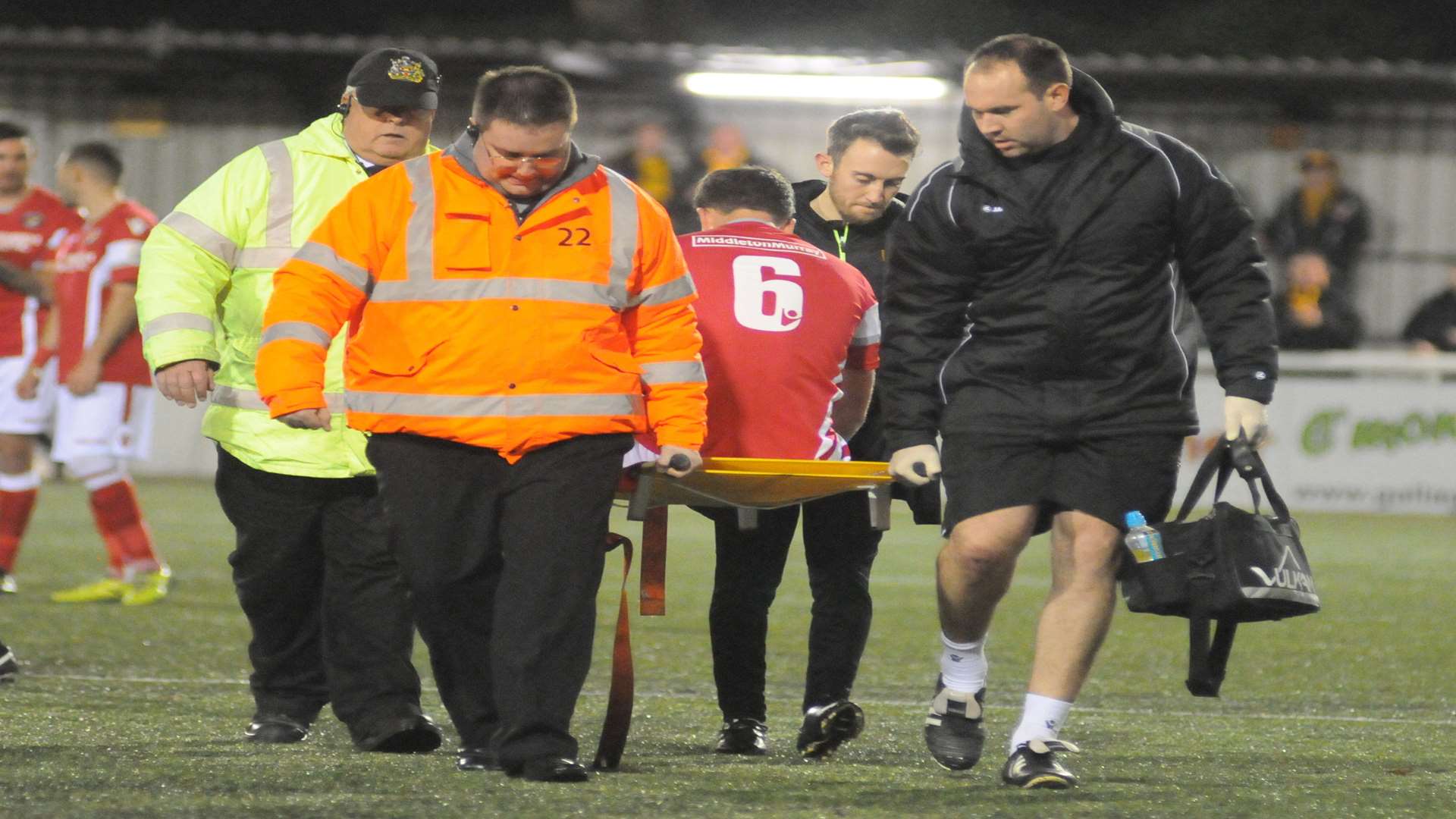 Lloyd Harrington leaves the pitch on a stretcher Picture: Steve Crispe