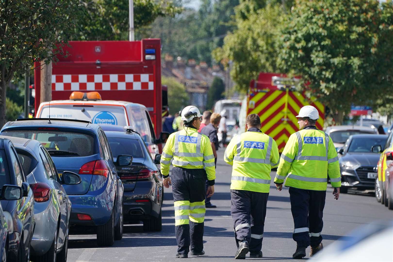 Gas staff at scene in Galpin’s Road in Thornton Heath, south London, where a house has collapsed in a fire and explosion (PA/Dominic Lipinski)