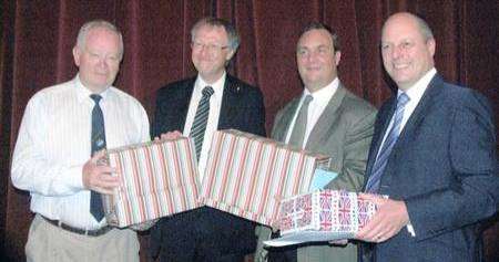 Glyn Thomson, chief executive of Gravesham council, with some of the guests and gifts at his leaving party. From left: Cllr David Turner (Con), Mr Thomson, Cllr John Burden (Lab, Council Leader) and Kevin Burbidge, Business Director