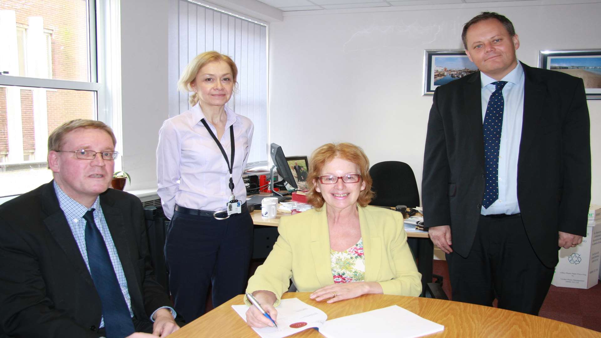Council leader Iris Johnston signs the contract with Director of Cardy Mike Stannard with Edwina Crowley and Colin Graham
