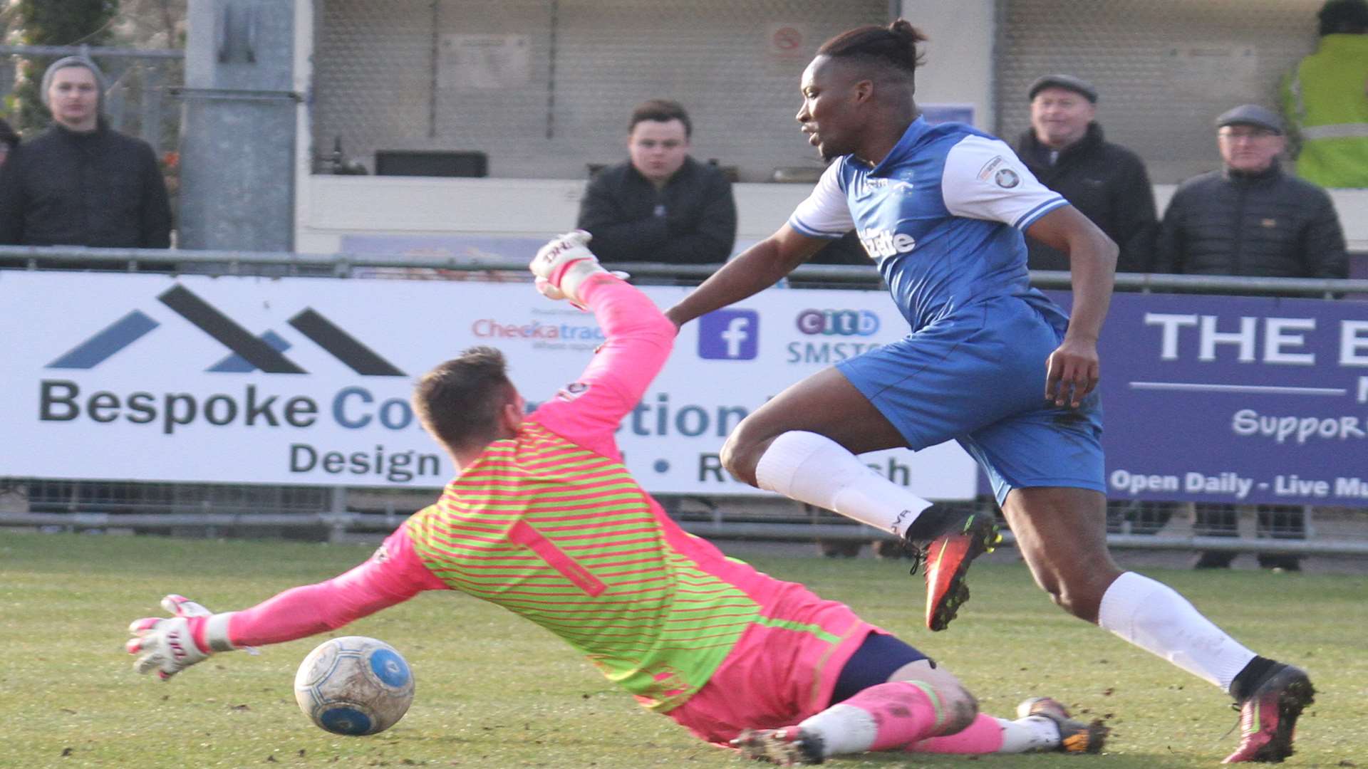 Margate's Pape Gueye is about to be brought down by Gosport keeper Nick Jordan Picture: Don Walker