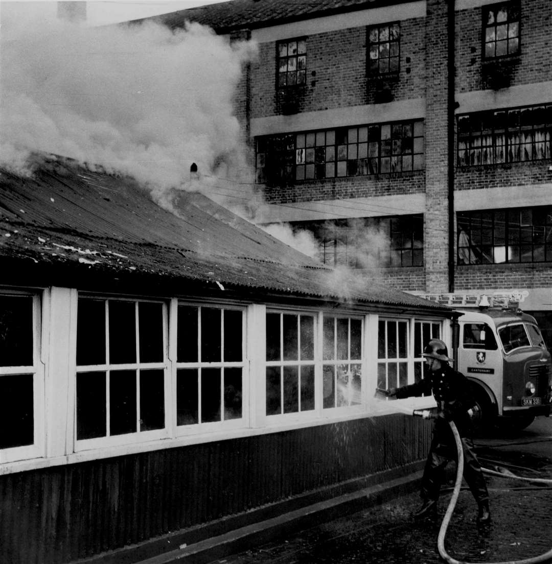 Firemen from Canterbury and Sturry tackle a blaze which destroyed the staff canteen at the Tannery in December 1961. It was discovered by Town Sergeant Harry Surridge, of Rosemary Lane, who was on his way to feed his two goats in St Mildred's churchyard. He tackled the fire with the Tannery's own equipment until the firemen arrived