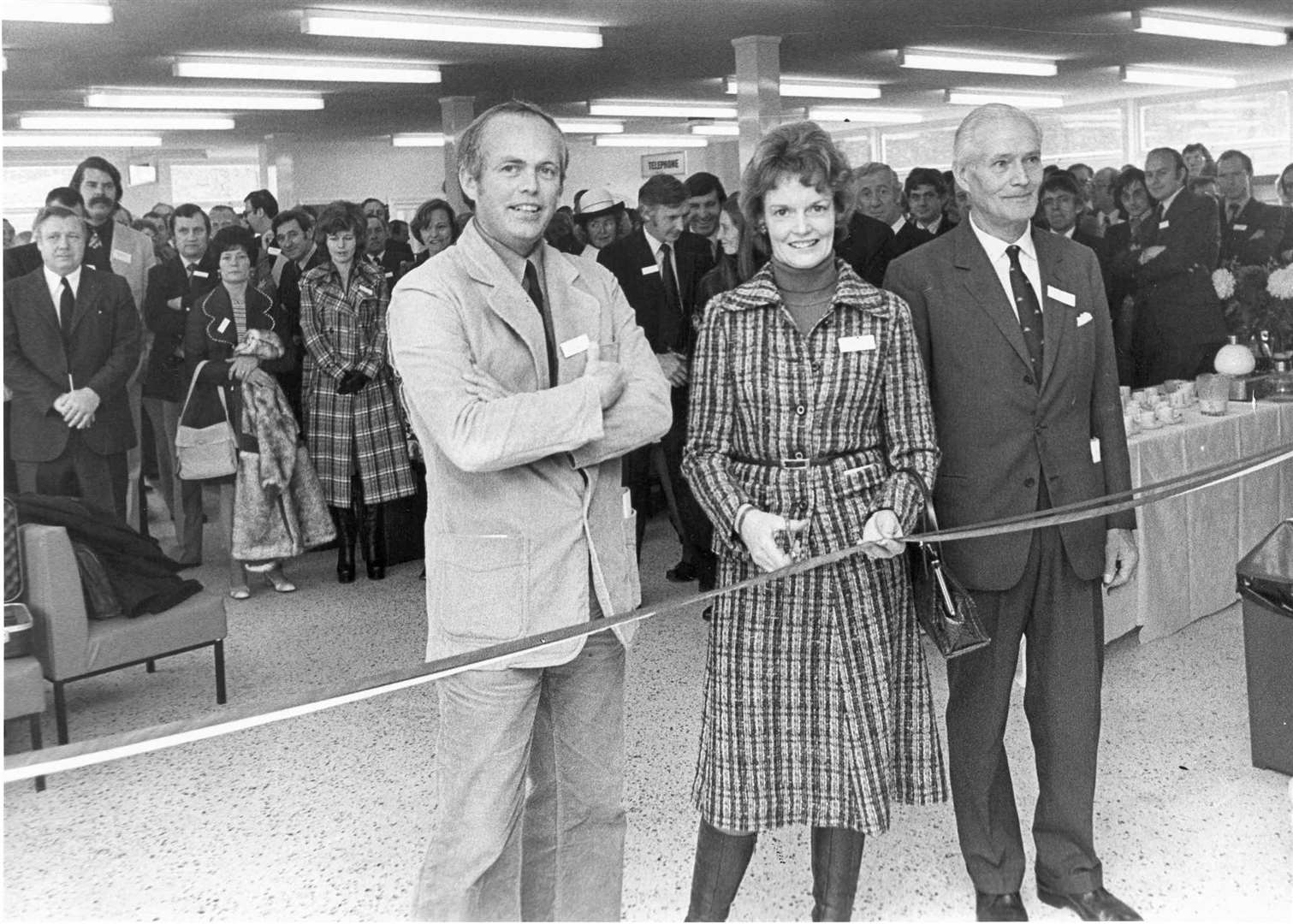 Shelagh Cooper cuts the tape to open the new passenger terminal at Sheerness Docks in 1975, watched by Ole Lauritzen, founder of the Olau-Line, and Mr N Staff, chairman Medway & Sheerness Ports Authority