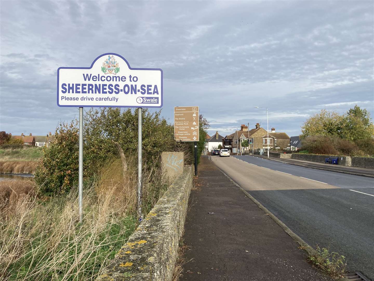 The Welcome to Sheerness sign opposite DRS car breakers at Monkey Farm
