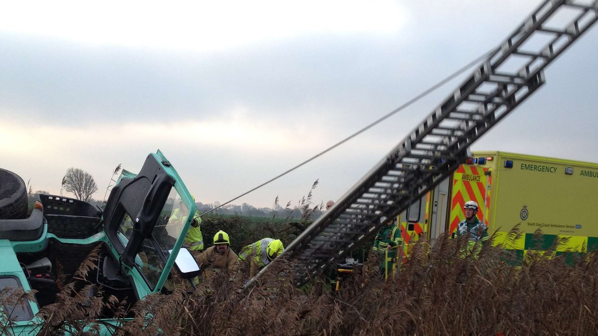 A fire engine ladder used to rescue a driver after his lorry rolled into a ditch at Brookland. Picture courtesy of South East Coast Ambulance Service.
