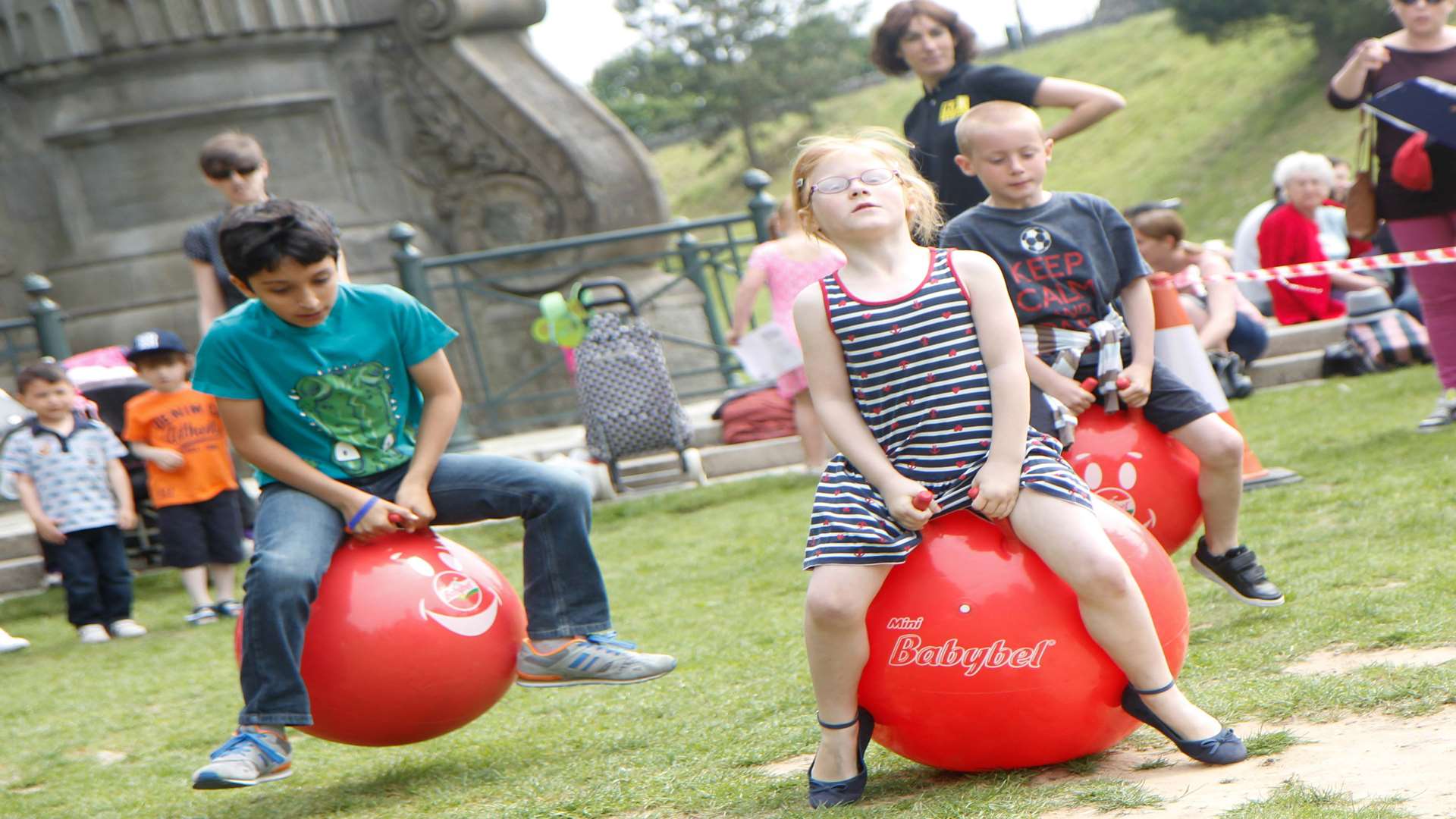 Children taking on a space hopper challenge at the 2014 Buster's Big Bash event.