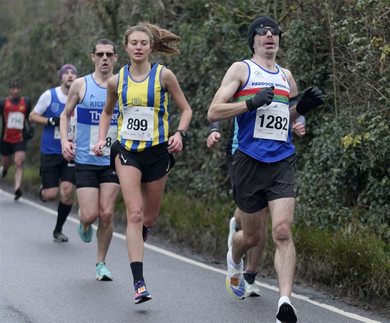 No.899 Emily Nash of Tunbridge Wells Harriers runs alongside No.1282 Mike Walter of Paddock Wood. Picture: Barry Goodwin (62013841)