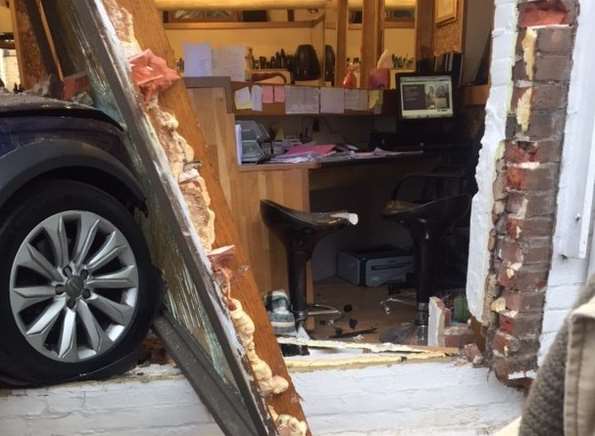 The car was left embedded in the building