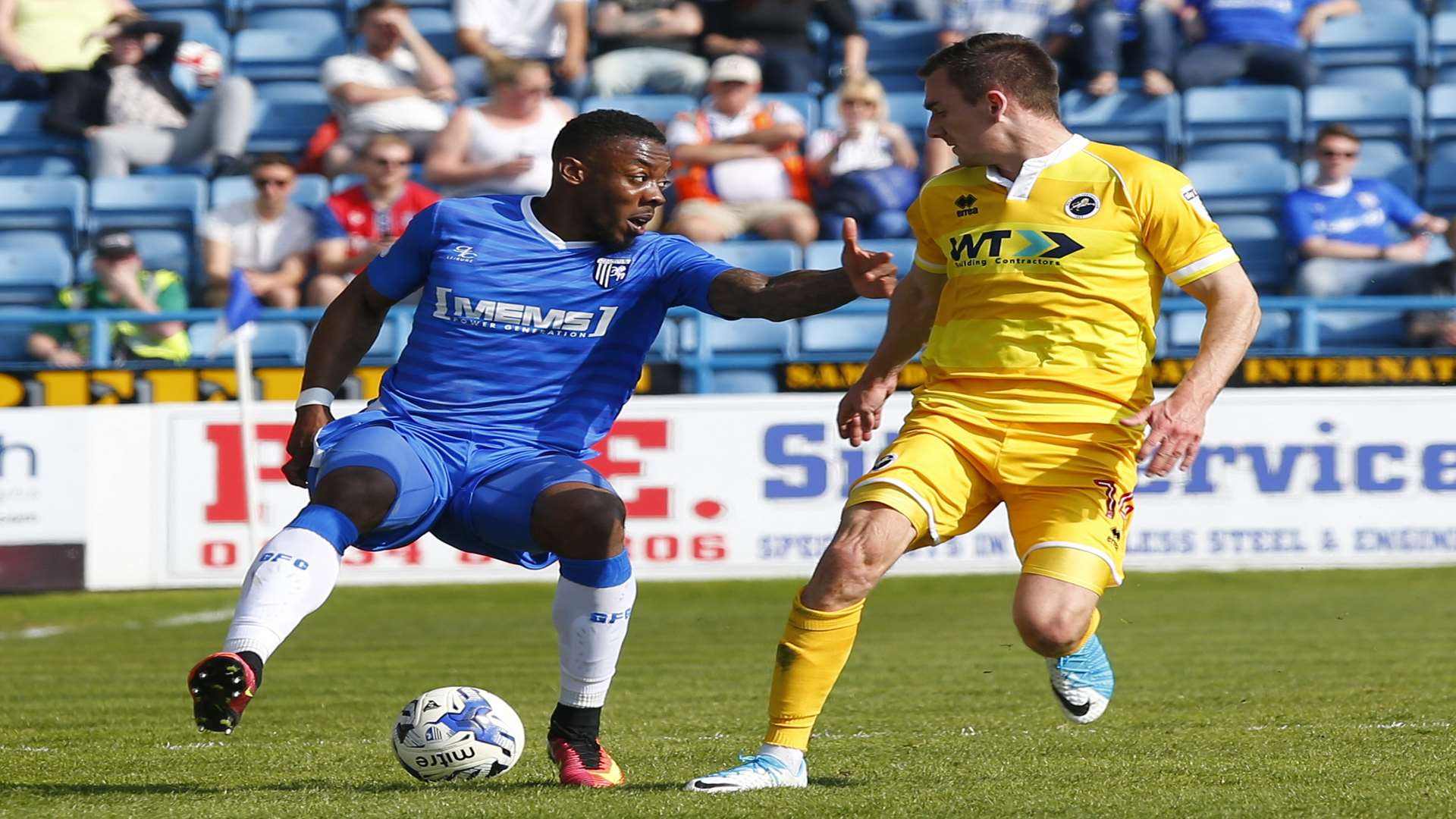 Gillingham's Ryan Jackson battles it out with Millwall's Jed Wallace on Saturday. Picture: Andy Jones