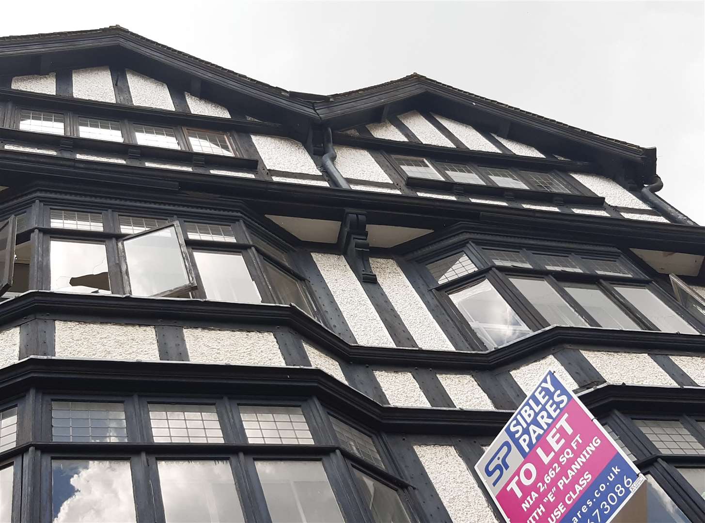 The timber is thought to have fallen from the front of the building, at the base of the top floor