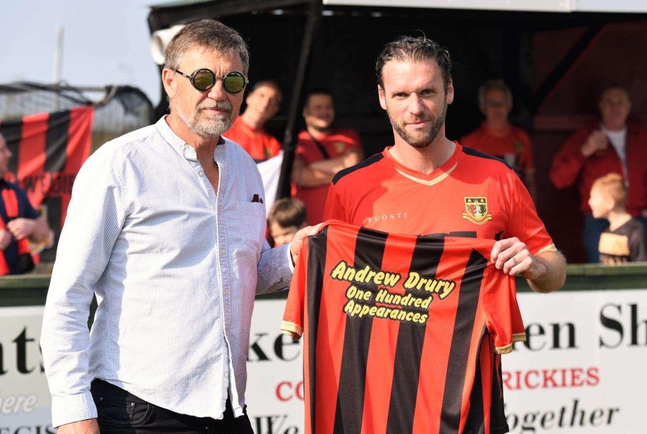 Andy Drury receives a shirt from chairman Maurice Dunk marking 100 appearances for Sittingbourne Picture: Ken Medwyn