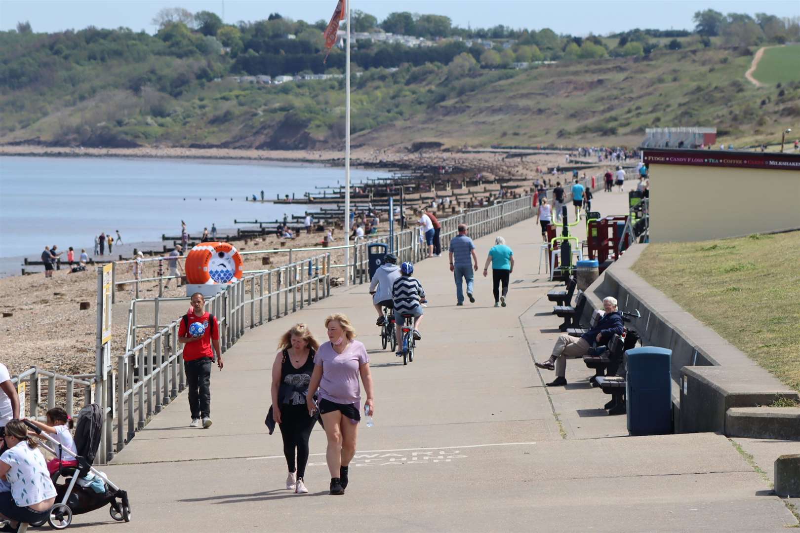 As lockdown measures eased in May, many took the chance to enjoy more freedom and good weather in Kent's open spaces, such as these walkers on the promenade at The Leas, Minster, Sheppey.