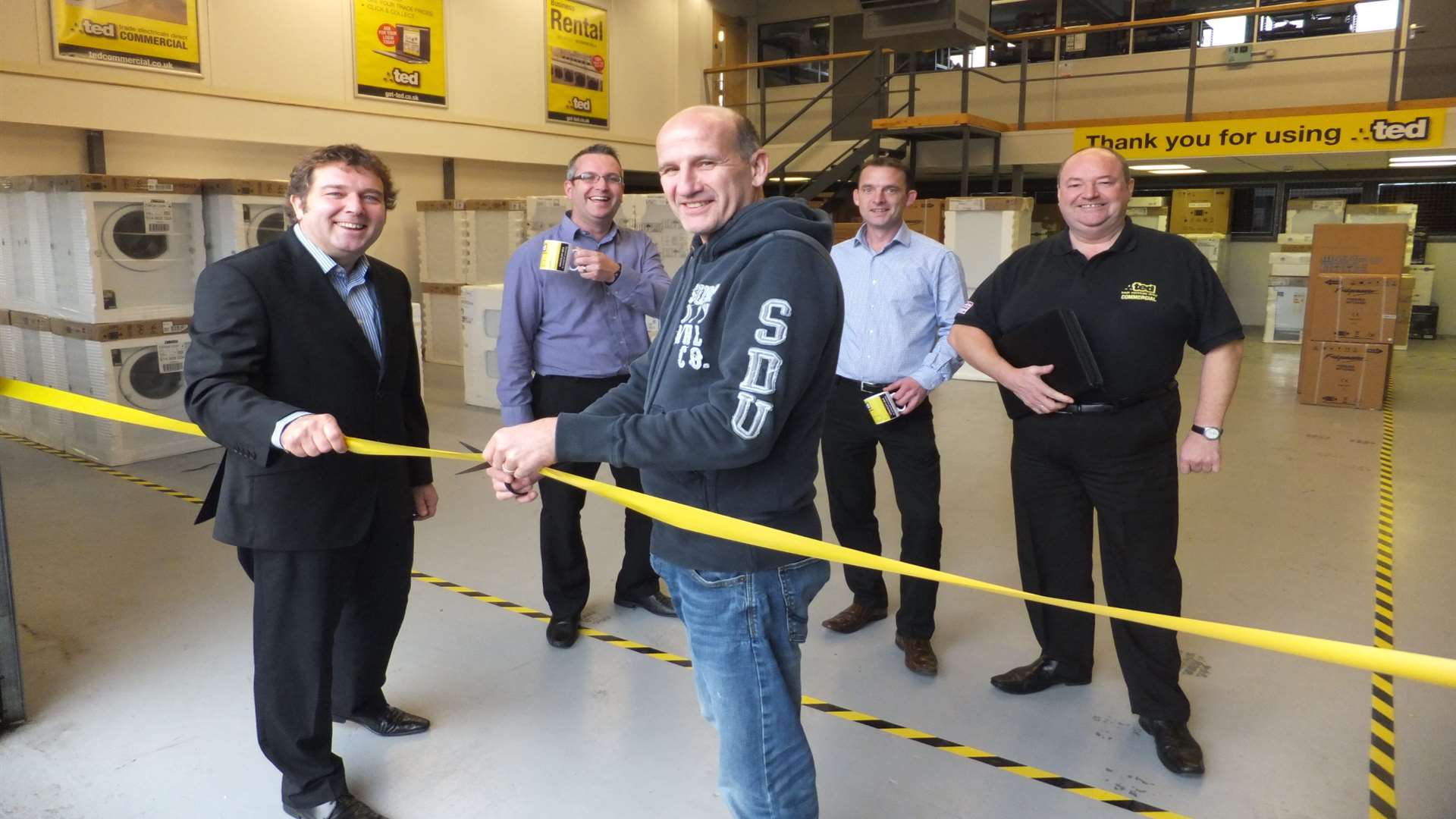 Simon Garrett-Tuffney and Paul Chisnall cut the ribbon on the new TED branch with, from left, TED Commercial manager Simon Quinlan, branch team leader Adam Smith-Reeve and senior commercial advisor Mark Whiteacre