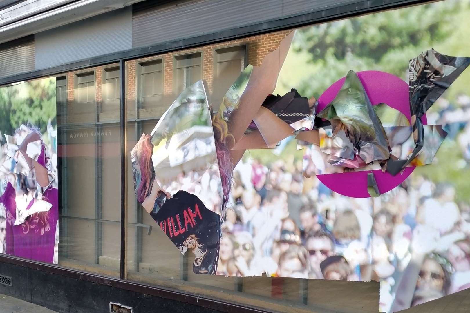 The vandalised window in Canterbury's former Debenhams store