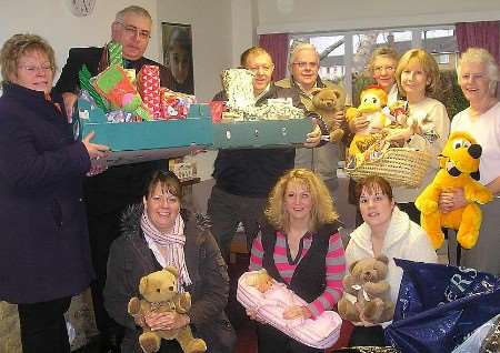 GOOD DEEDS: Neighbourhood Watch Association members with staff from the Family Support Unit