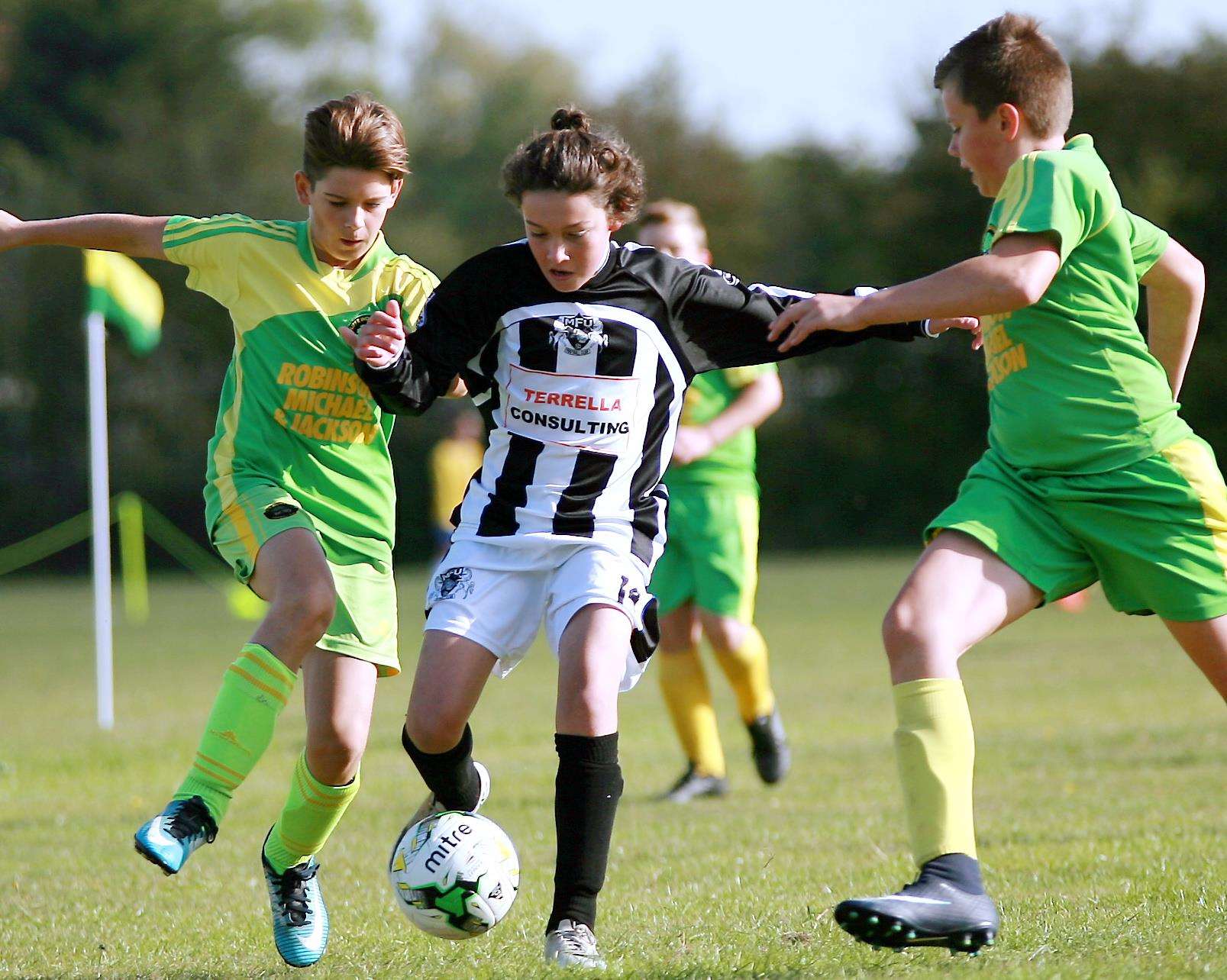 Cliffe Woods Colts (green/yellow) up against Milton & Fulston United in Under-12 Division 2 Picture: Phil Lee