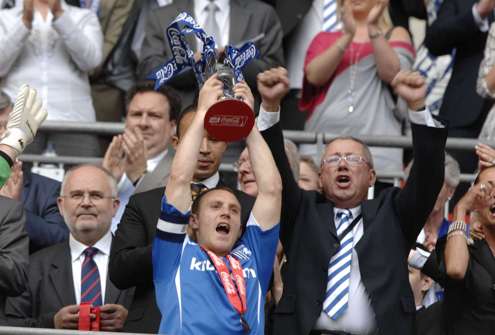 Barry Fuller lifts the League 2 play-off trophy at Wembley - the highlight of his Gills career Picture: Matthew Walker