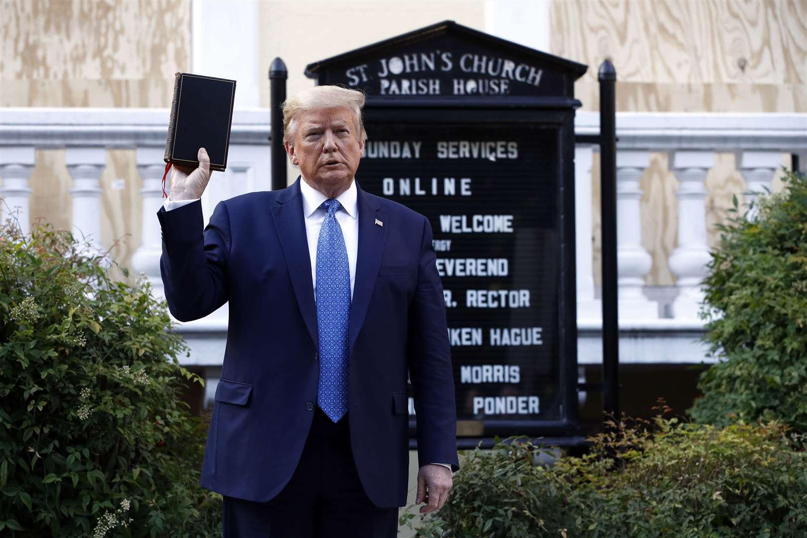 President Donald Trump holds a Bible outside St John’s Church across Lafayette Park from the White House on Monday (Patrick Semansky/AP)