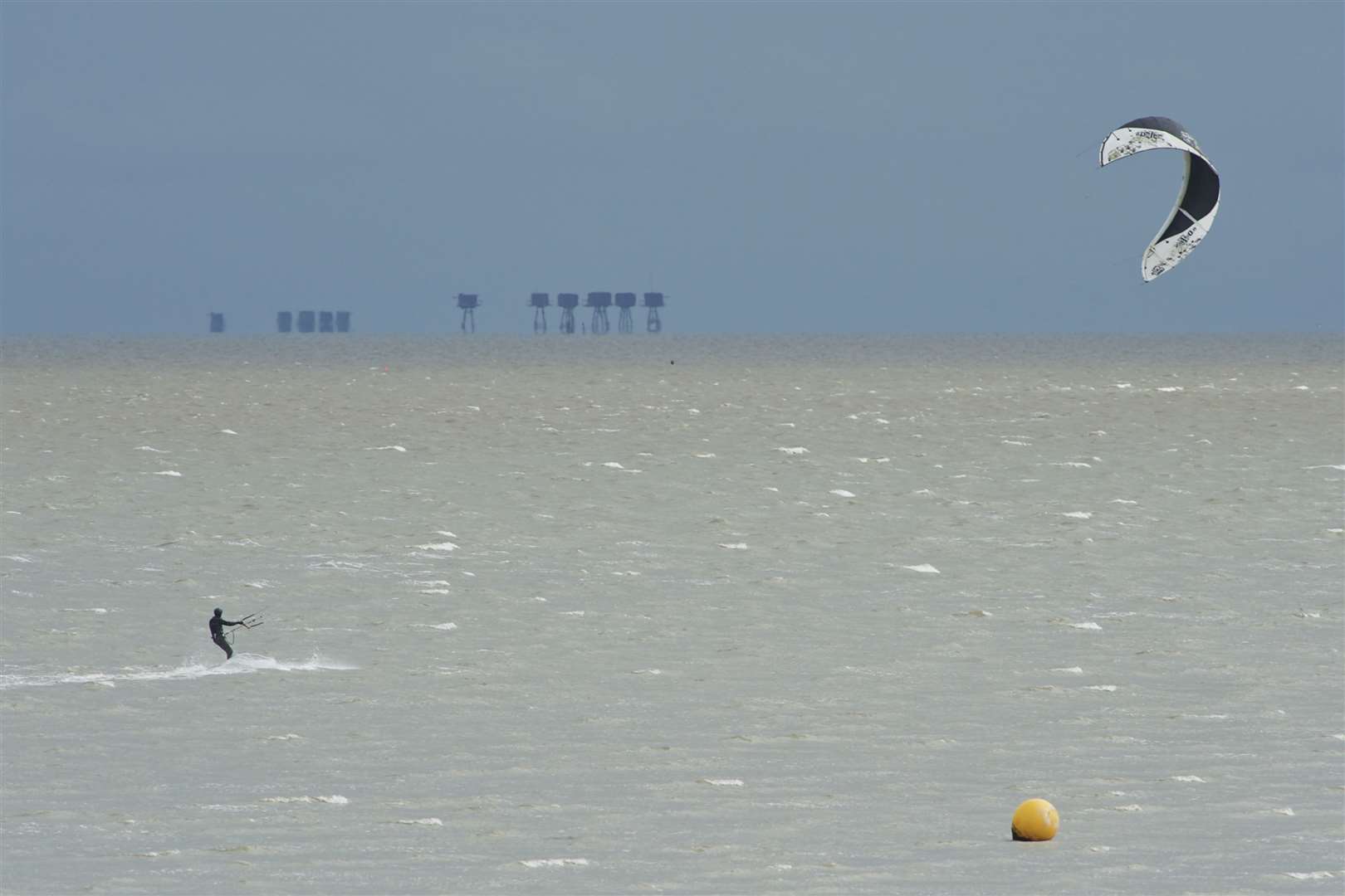 A kite surfer braves the cold to take advantage of a strong northerly wind off the beach at Minster, Sheppey. Stock picture: Andy Payton