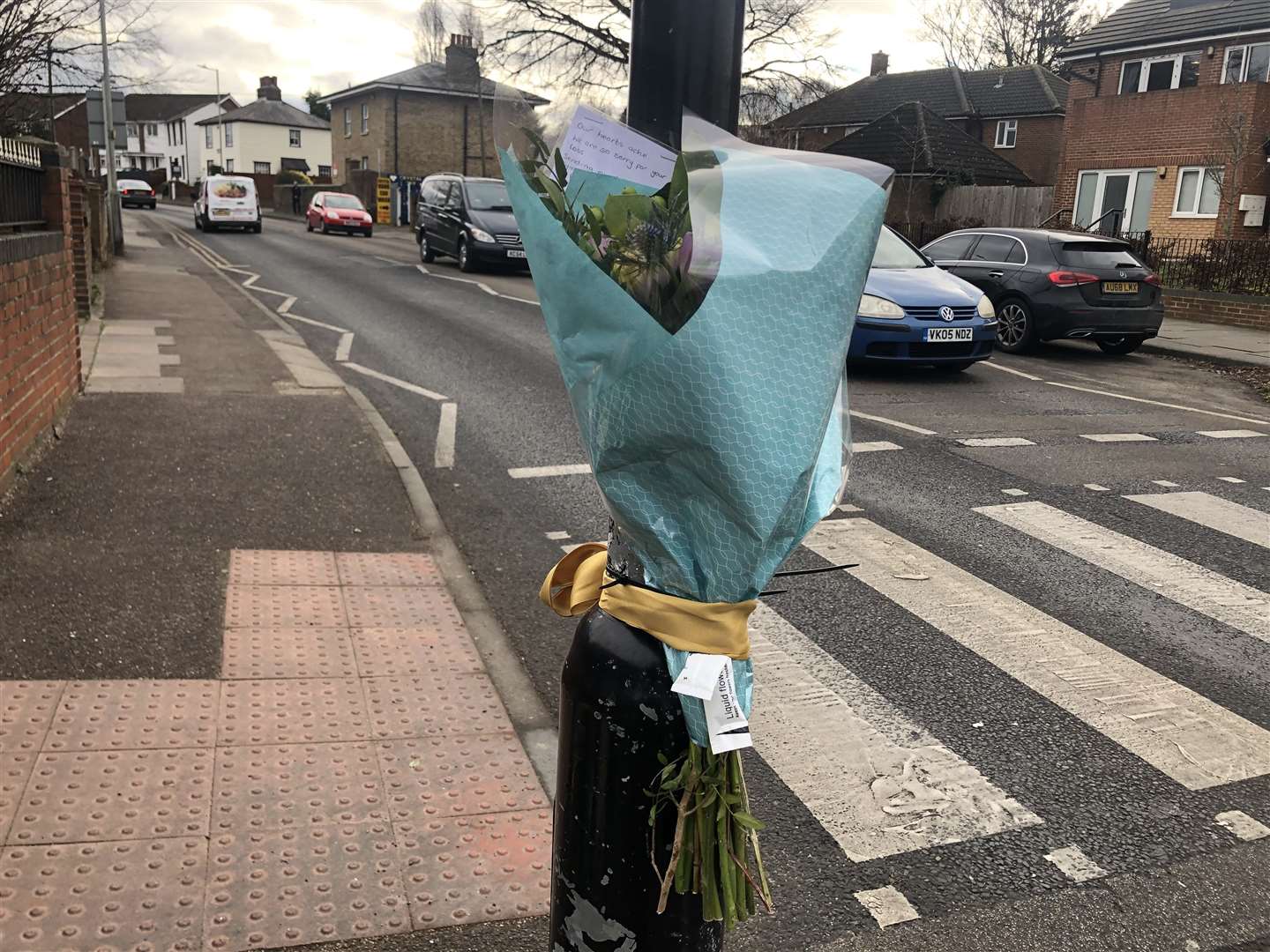 Floral, candle and basketball tributes were laid near the crossing on February 3