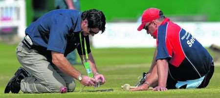 ECB Pitch Consultant Chris Wood inspects the St Lawrence Ground pitch with Head Groundsman Andy Pierson.