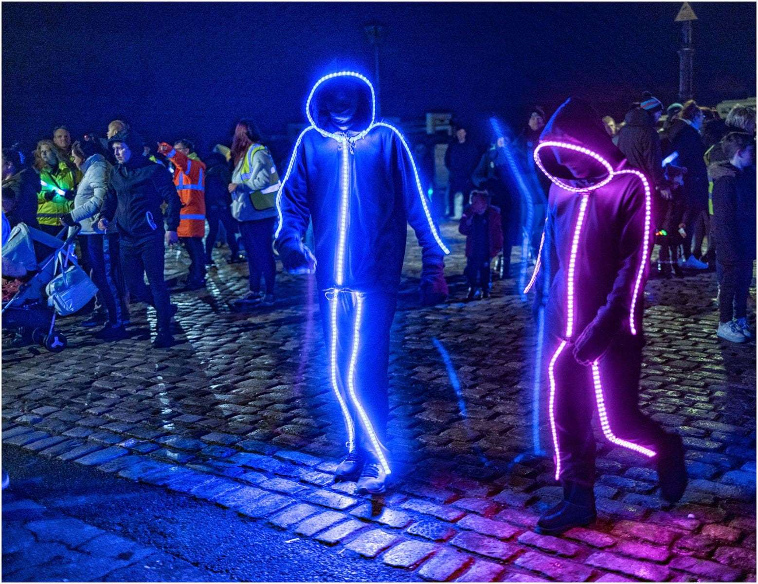 Light fantastic: These two illuminated walkers brightened up the Queenborough lantern parade. Picture: Henry Slack