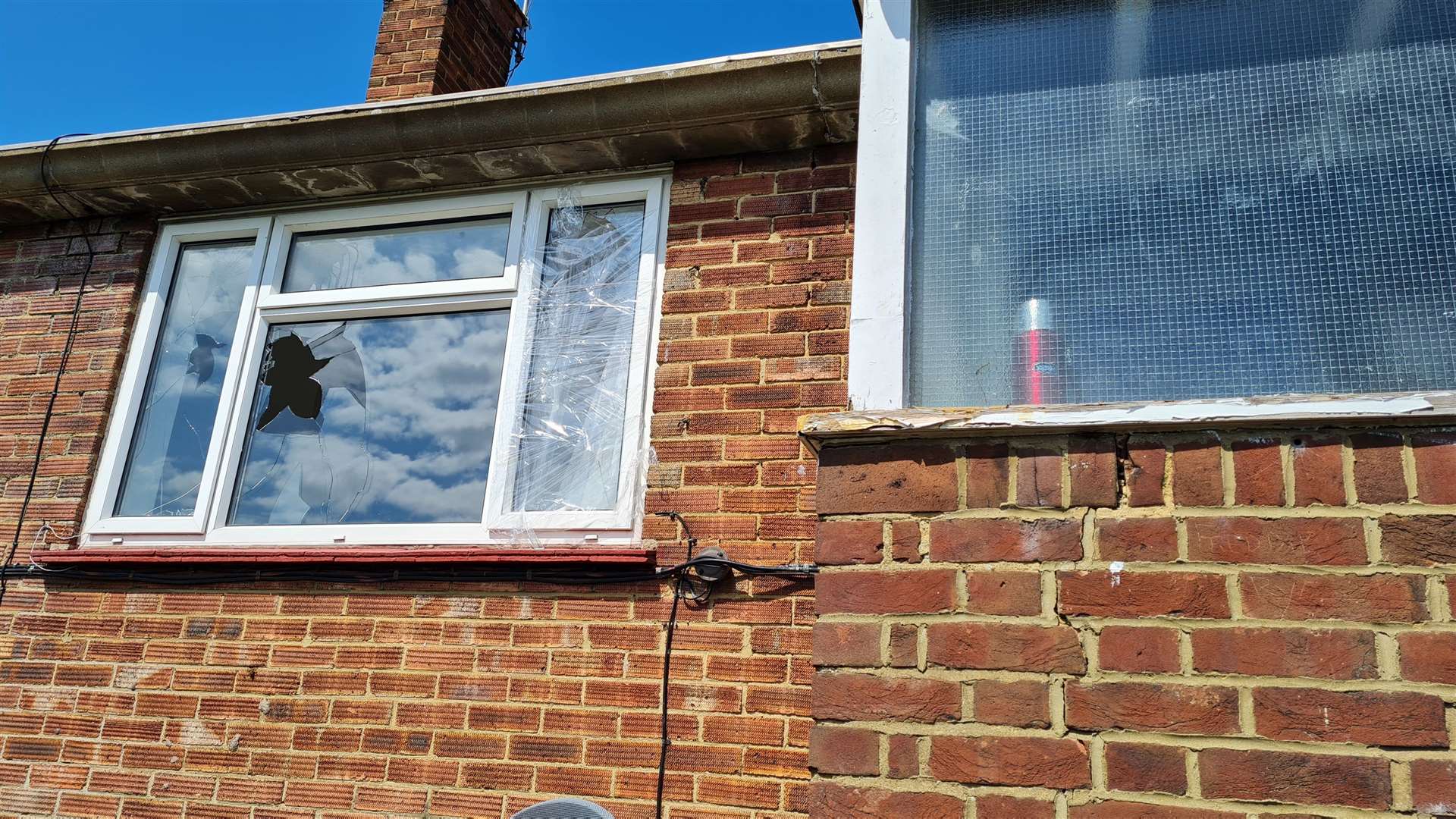 A broken window at the flat