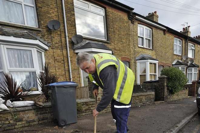 Hugh McCaughan, from Veolia, clearing up mess from flooding in Albert Road, Deal. Picture: Tony Flashman