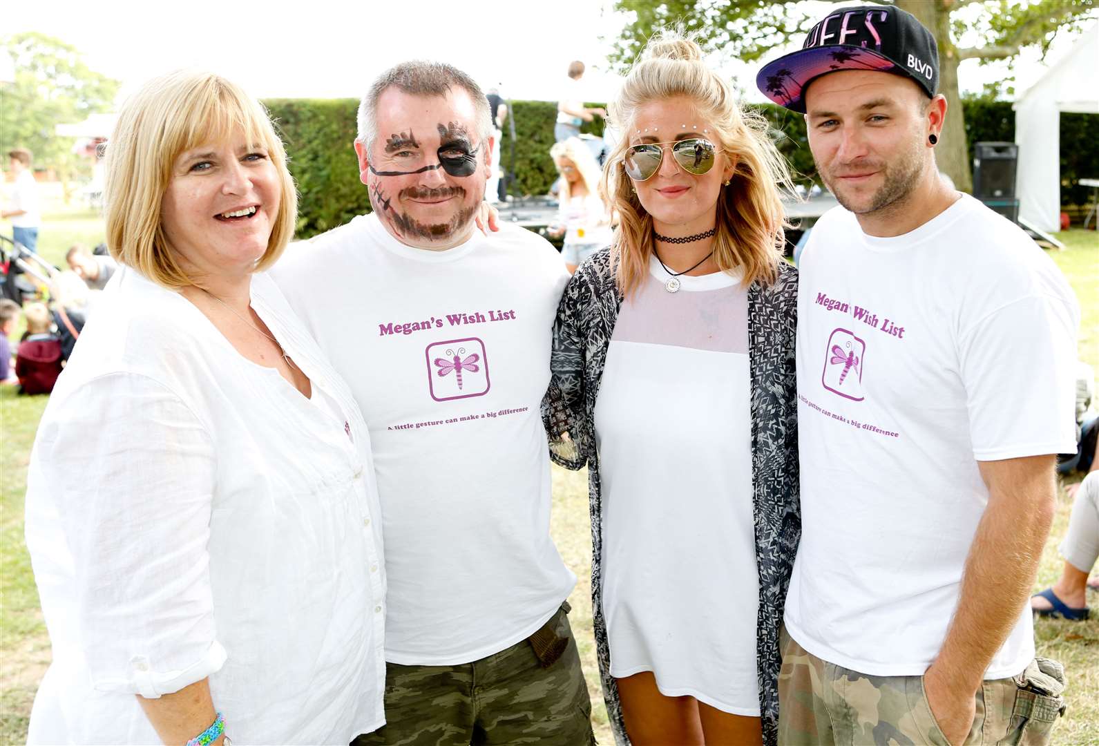 Parents Lucy and Chris and Megan's sister Jess with DJ Chris Nottingham at a previous festival