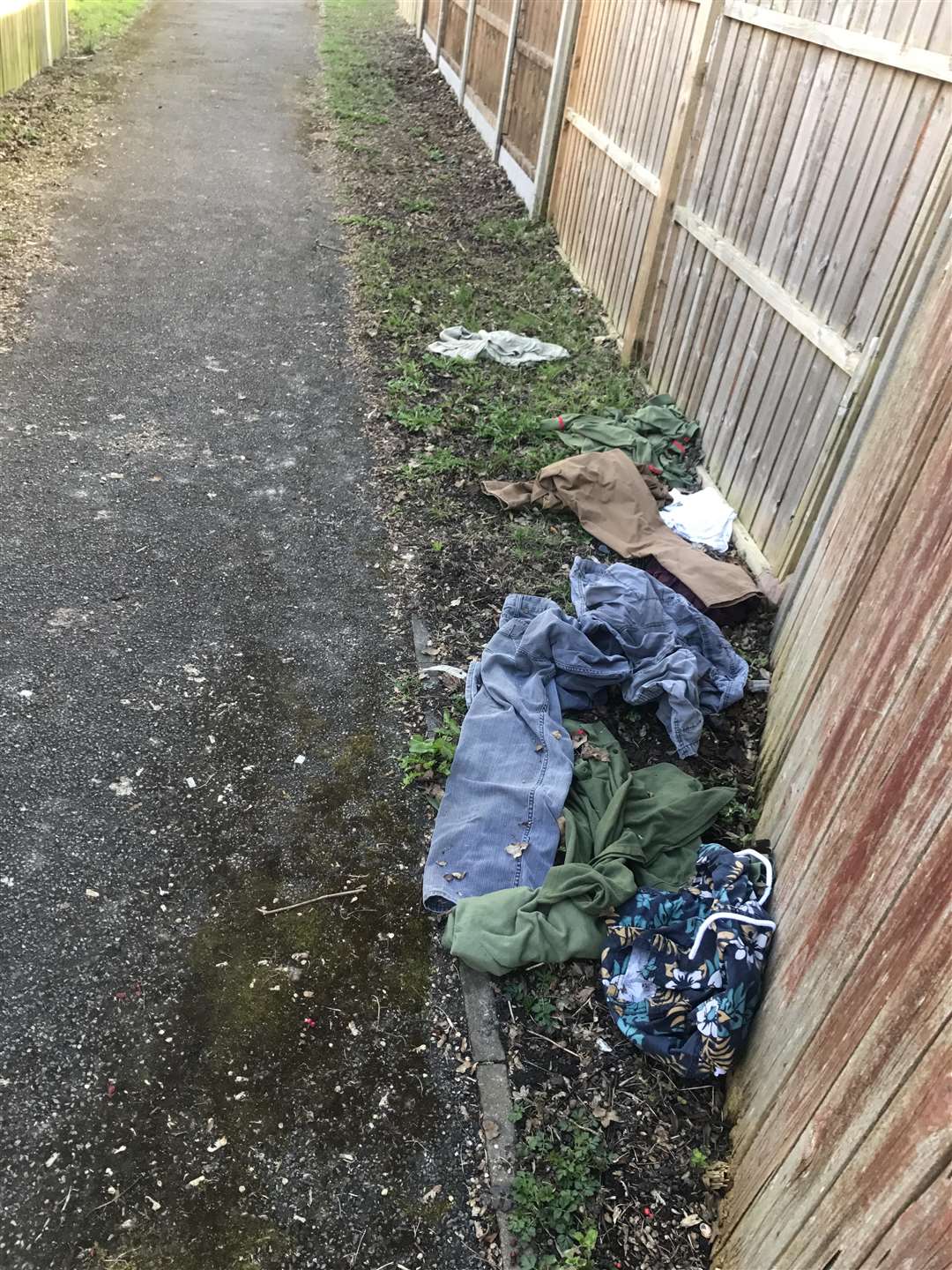 Clothes are often dumped along the path (1554201)