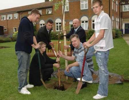 LEFT TO RIGHT: Dave Chapman, Sue Chapman, head techer Jon Whitcombe, Colin Kelly of Eddie Stobart, Lloyd Chapman and Richard Hibberd-Smart with the tree. Picture: ANDY PAYTON