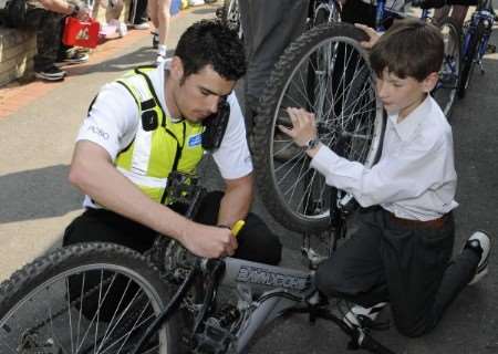 PCSO Haydn Powlter at Cartwright and Kelsey School, Ash, marking the bike of John Wilkinson
